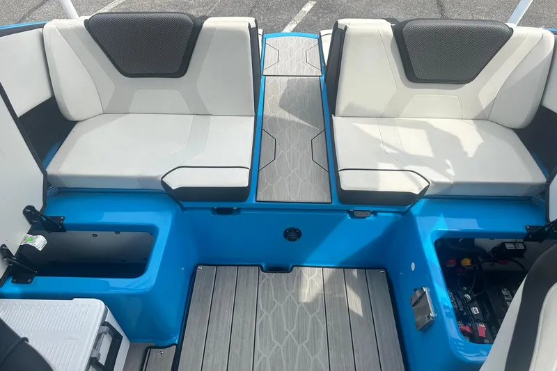 Slide: The Image of 2023 Yamaha Boats 222XD interior with blue accents and cushioned seating. - 17