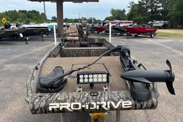 Slide: The Image of 2022 Pro-Drive X Series TD Edition 1854 boat in a dealership lot. - 10