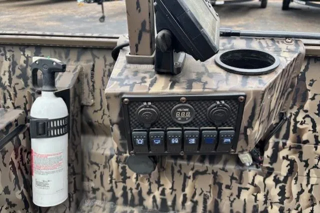 Slide: The Image of Control panel of 2022 Pro-Drive X SERIES TD EDITION 1854 with camouflage design and fire extinguisher. - 14