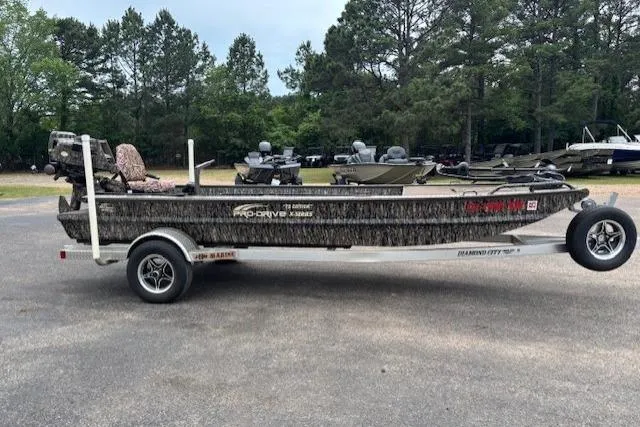 Slide: The Image of 2022 Pro-Drive X SERIES TD EDITION 1854 boat on trailer, parked outdoors. - 8