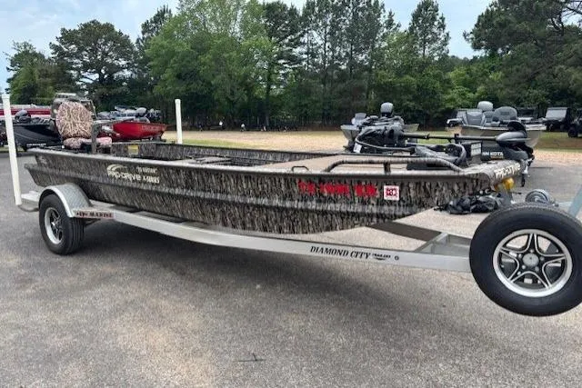 Slide: The Image of 2022 Pro-Drive X SERIES TD EDITION 1854 boat on trailer, parked outdoors. - 9