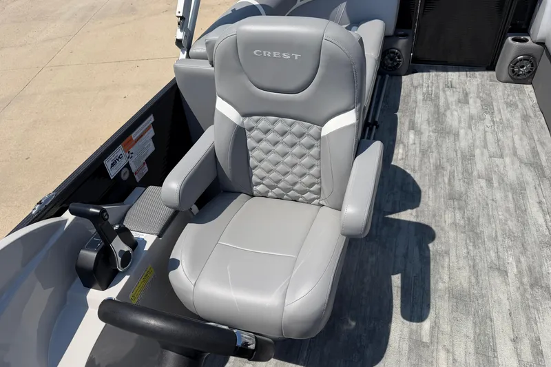 Slide: The Image of 2023 Crest Classic DLX 240 SLC boat seat with gray upholstery and diamond stitching. - 16
