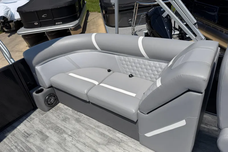 Slide: The Image of 2023 Crest Classic DLX 240 SLC boat interior with luxurious gray seating and modern design. - 19