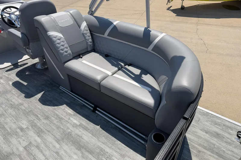 Slide: The Image of 2023 Crest Classic DLX 240 SLC boat with luxurious gray seating and modern design. - 21