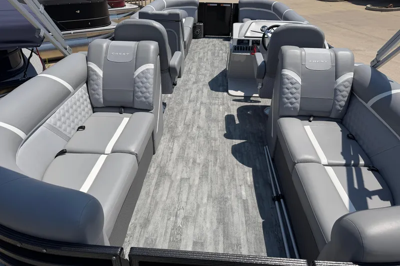 Slide: The Image of 2023 Crest Classic DLX 240 SLC pontoon boat interior with gray seating and modern design. - 23