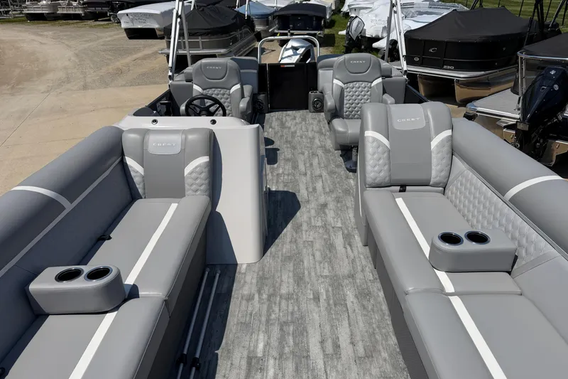 Slide: The Image of 2023 Crest Classic DLX 240 SLC pontoon boat with luxurious gray seating and modern design. - 3