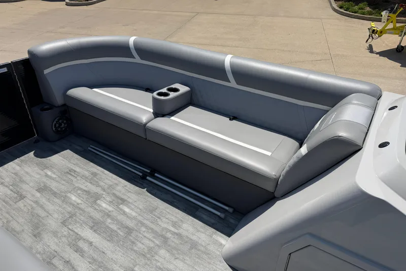 Slide: The Image of 2023 Crest Classic DLX 240 SLC boat interior with gray seating and cup holders. - 9