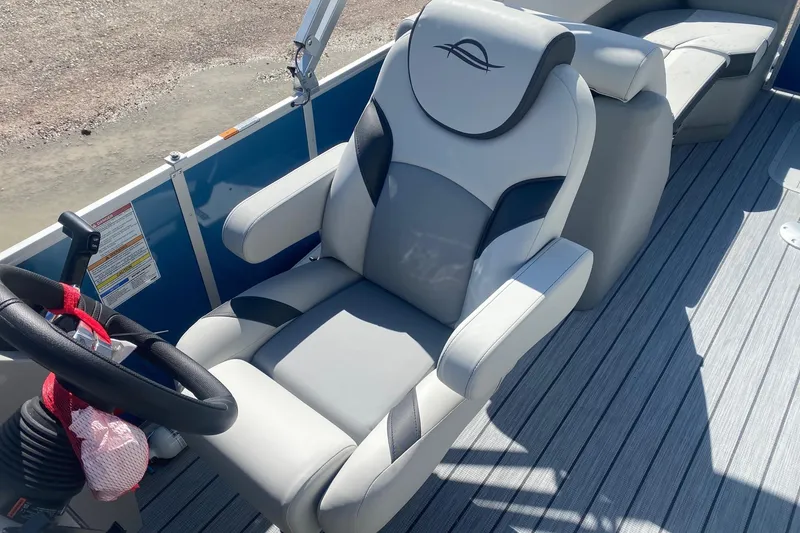 Slide: The Image of Captain's chair on 2026 SunCatcher Select 322RC pontoon boat, featuring sleek design and comfortable seating. - 11