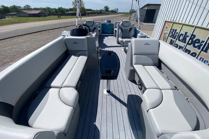 Slide: The Image of Interior of 2026 SunCatcher Select 322RC pontoon boat with spacious seating and sleek design. - 7