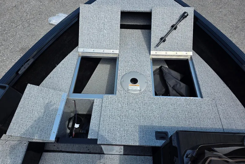 Slide: The Image of 2026 Smoker Craft Pro Angler 165 SC boat interior with storage compartments. - 12