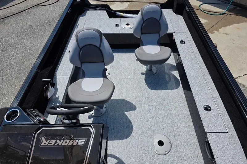 Slide: The Image of 2026 Smoker Craft Pro Angler 165 SC interior with two seats and steering console. - 14