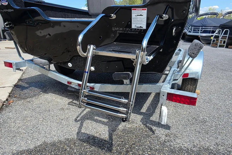 Slide: The Image of 2026 Smoker Craft Pro Angler 165 SC boat on trailer with foldable ladder. - 6