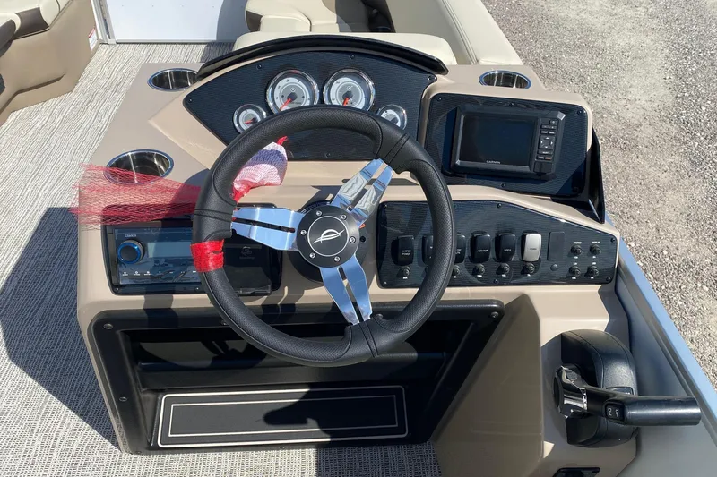 Slide: The Image of Steering console of 2026 SunCatcher Select 22RF pontoon boat with gauges and controls. - 9
