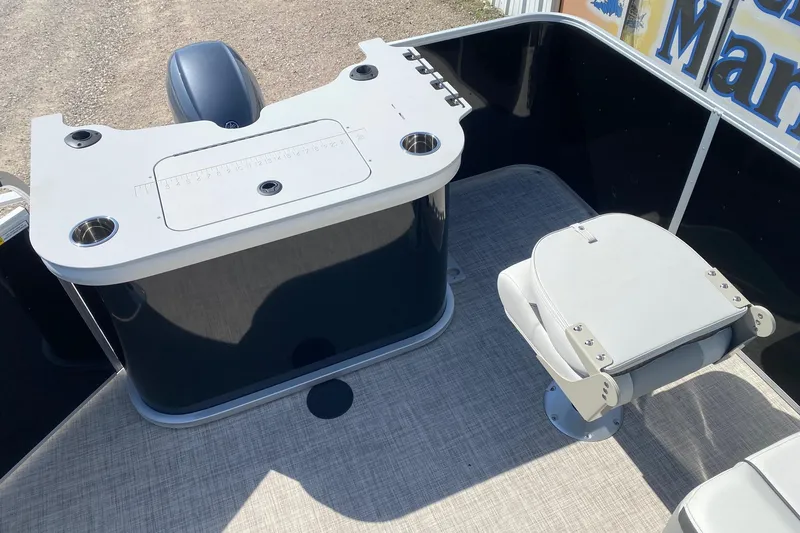 Slide: The Image of SunCatcher Select 18F 2026 boat interior with seating and storage area. - 11