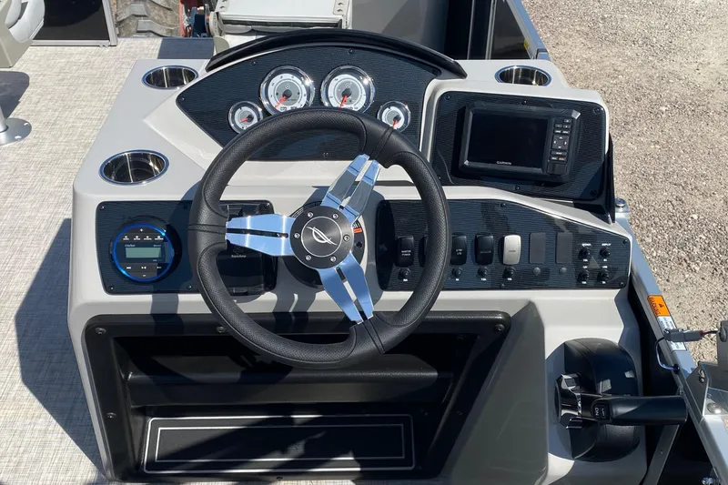 Slide: The Image of Steering console of 2026 SunCatcher Select 18F boat with modern controls and gauges. - 13