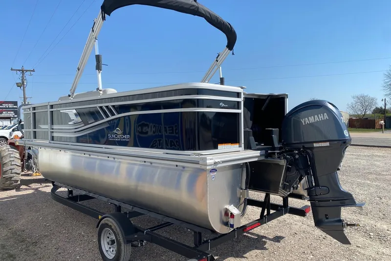 Slide: The Image of 2026 SunCatcher Select 18F pontoon boat with Yamaha motor on trailer. - 4