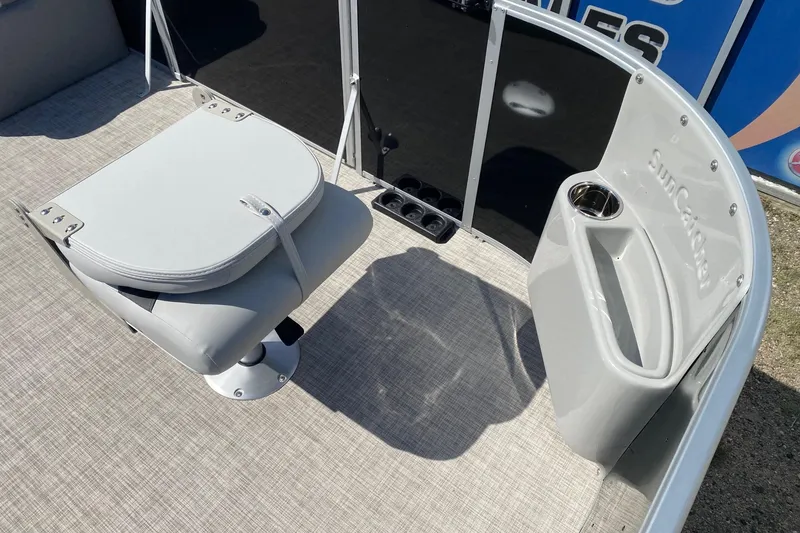 Slide: The Image of 2026 SunCatcher Select 18F boat interior with seating and cup holder. - 8