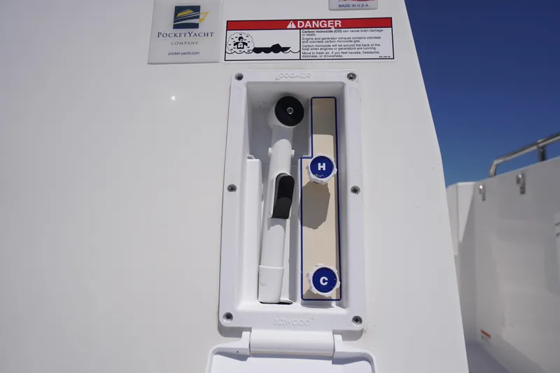 Slide: The Image of Control panel on a 2019 Cutwater C-242 Sport Coupe boat, featuring hot and cold water controls. - 14
