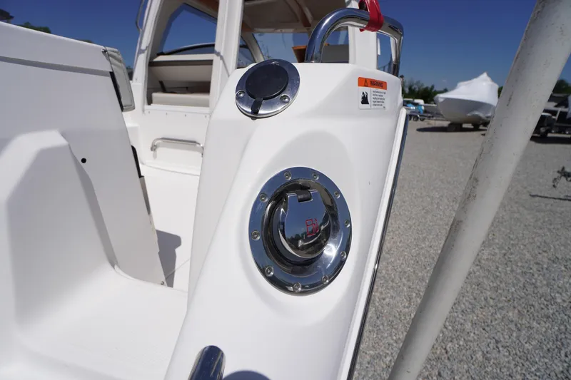 Slide: The Image of 2019 Cutwater C-242 Sport Coupe boat detail with chrome fittings and white interior. - 15