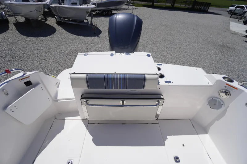 Slide: The Image of 2019 Cutwater C-242 Sport Coupe boat interior with seating and storage. - 16
