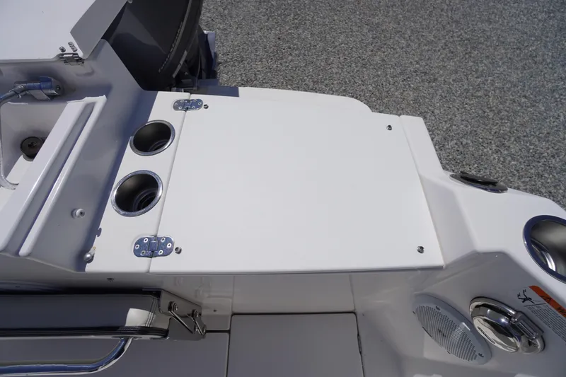 Slide: The Image of 2019 Cutwater C-242 Sport Coupe boat deck with cup holders and storage compartment. - 18