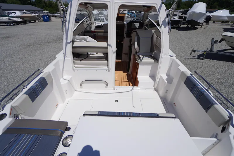 Slide: The Image of 2019 Cutwater C-242 Sport Coupe boat interior with seating and helm station. - 23