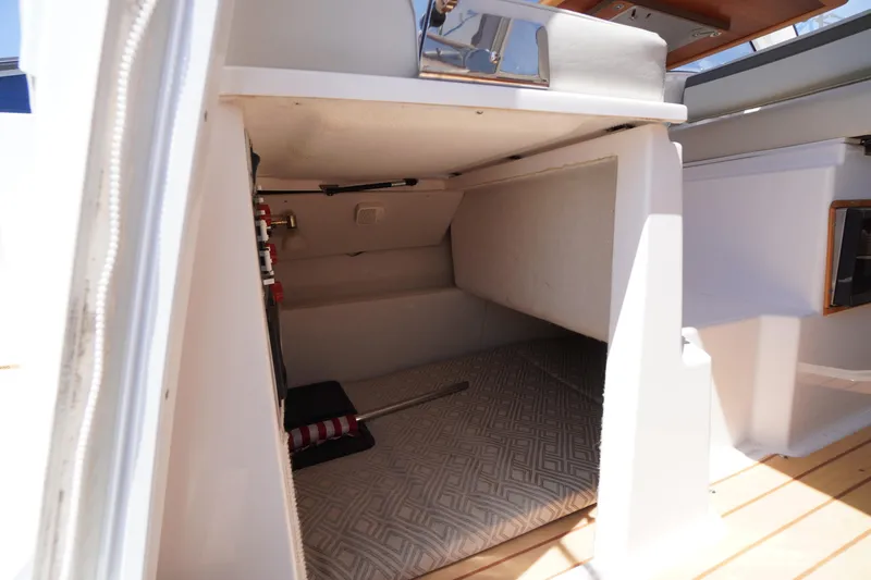 Slide: The Image of 2019 Cutwater C-242 Sport Coupe interior cabin with storage space and patterned flooring. - 30