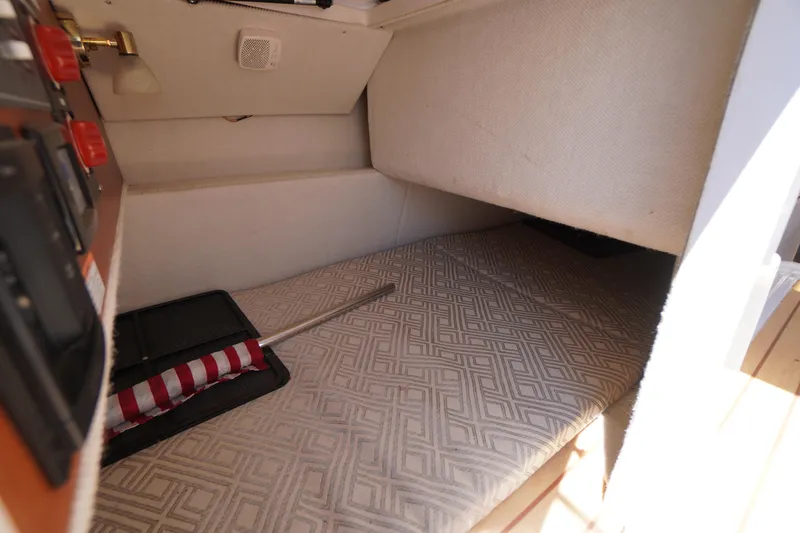 Slide: The Image of Interior cabin of 2019 Cutwater C-242 Sport Coupe with patterned bedding. - 31