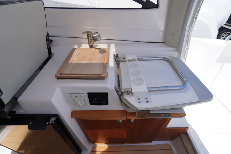 Slide: The Image of 2019 Cutwater C-242 Sport Coupe interior with cutting board and foldable seat. - 38