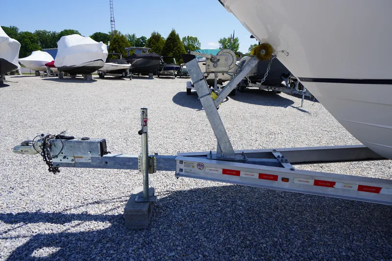 Slide: The Image of Trailer hitch of a 2019 Cutwater C-242 Sport Coupe boat in a gravel lot. - 4