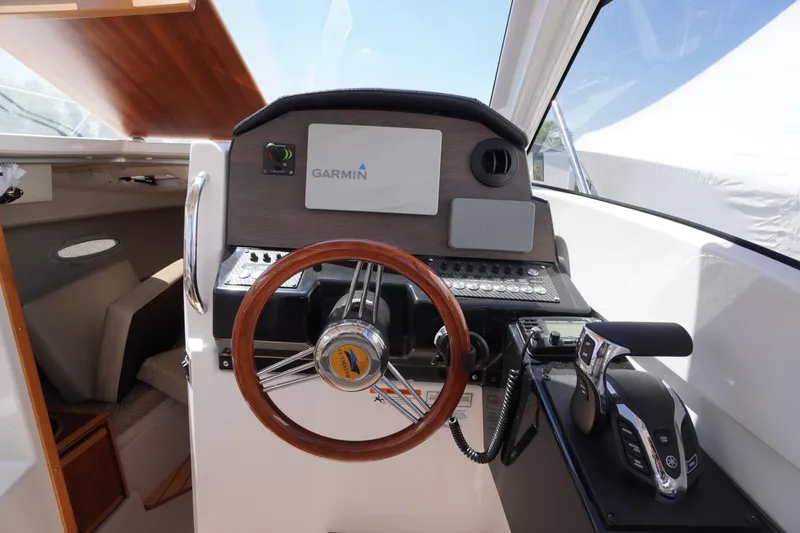 Slide: The Image of 2019 Cutwater C-242 Sport Coupe helm with Garmin navigation and wooden steering wheel. - 41