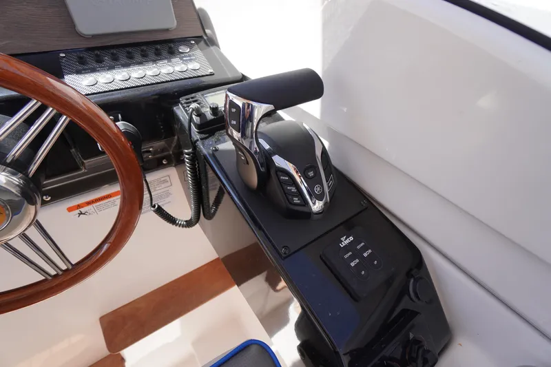 Slide: The Image of 2019 Cutwater C-242 Sport Coupe helm with steering wheel and control panel. - 44