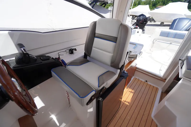 Slide: The Image of 2019 Cutwater C-242 Sport Coupe interior with helm seat and control panel. - 45