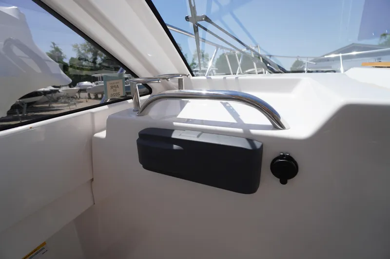 Slide: The Image of 2019 Cutwater C-242 Sport Coupe interior with sleek design and stainless steel railing. - 47