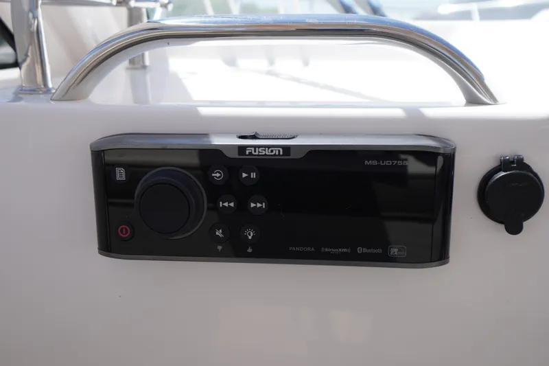 Slide: The Image of Fusion MS-UD755 audio system on 2019 Cutwater C-242 Sport Coupe boat dashboard. - 48