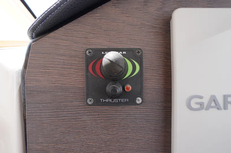 Slide: The Image of Control panel of a 2019 Cutwater C-242 Sport Coupe boat thruster. - 52