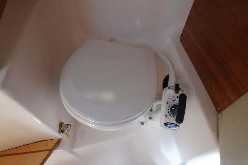 Slide: The Image of Marine toilet in 2019 Cutwater C-242 Sport Coupe boat interior. - 56