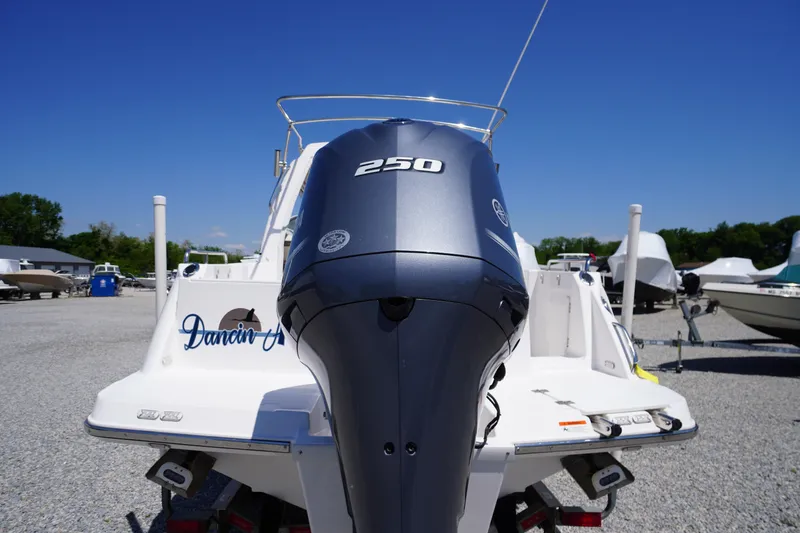 Slide: The Image of 2019 Cutwater C-242 Sport Coupe with 250 horsepower engine, parked outdoors. - 8