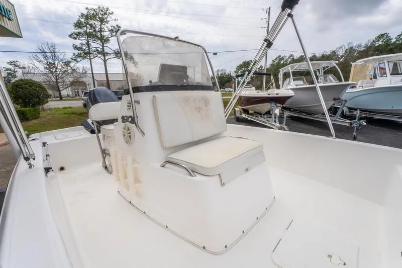 Slide: The Image of 2005 Century 1902 Inshore boat with center console, parked outdoors on a cloudy day. - 3