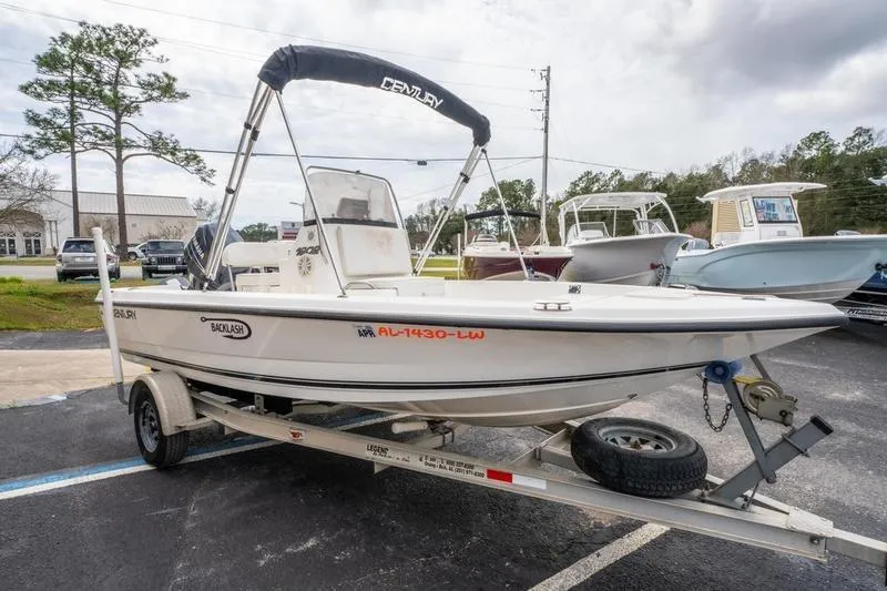 Slide: The Image of 2005 Century 1902 Inshore boat on trailer, parked outdoors. - 5