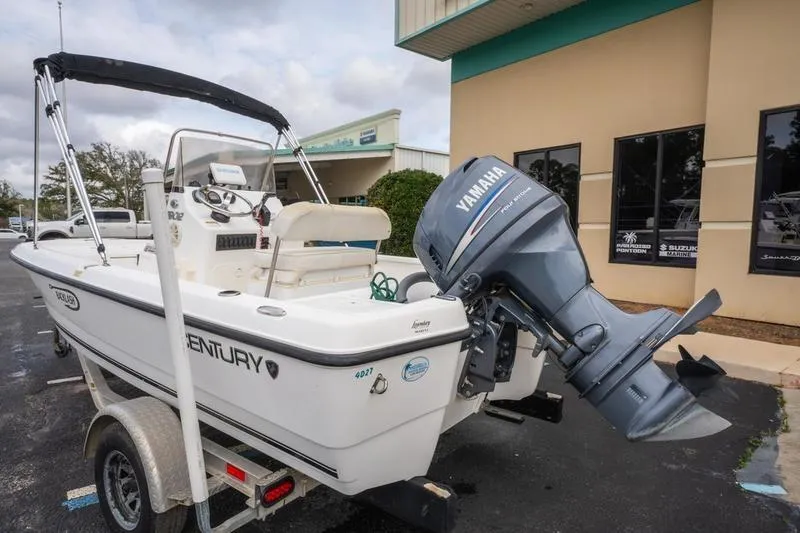 Slide: The Image of 2005 Century 1902 Inshore boat with Yamaha outboard motor on trailer. - 6