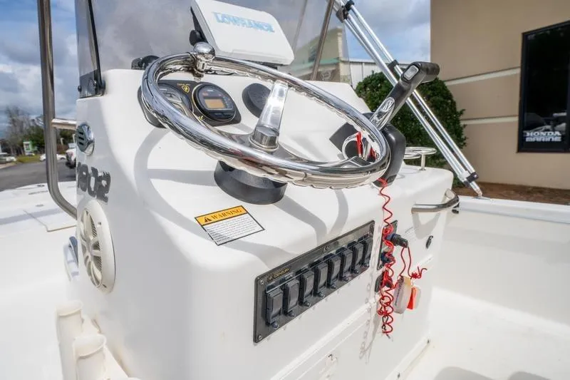 Slide: The Image of 2005 Century 1902 Inshore boat console with steering wheel and controls. - 9