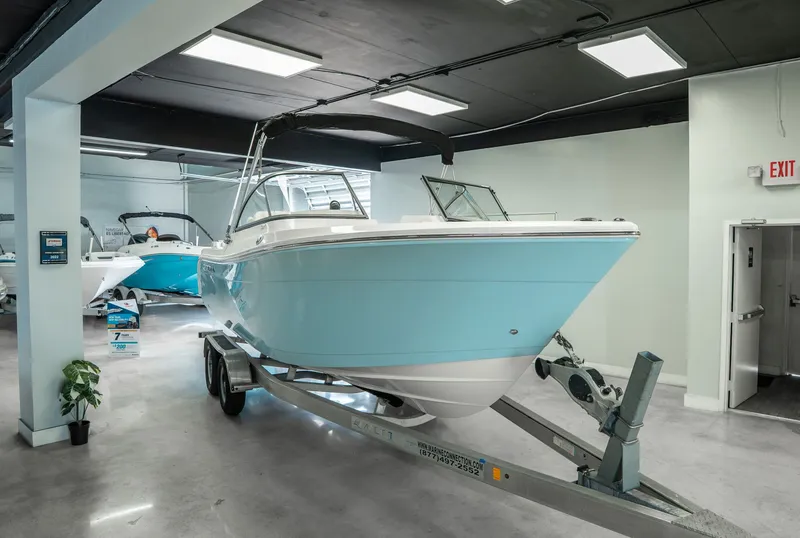 The Image of 2024 Cobia 220 Dual Console boat in showroom. - 1