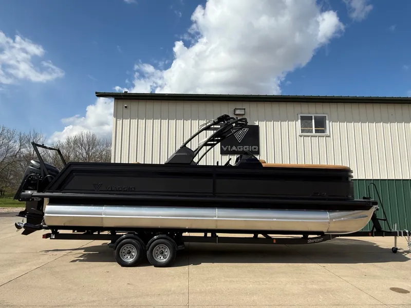 The Image of Viaggio Lago Z 24 S 2026 pontoon boat in front of warehouse. - 0
