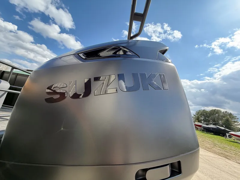 Slide: The Image of Suzuki outboard motor under blue sky, Viaggio Lago Z 24 S, 2026. - 11