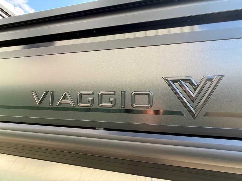 Slide: The Image of Viaggio Lago Z 24 S 2026 logo on metallic surface. - 7