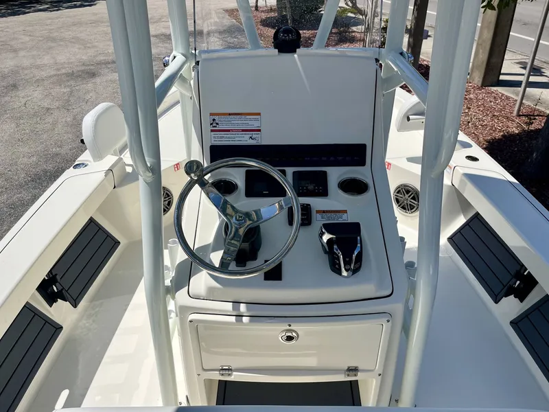 Slide: The Image of Interior view of 2026 Pathfinder 2200 TRS boat with steering console. - 11