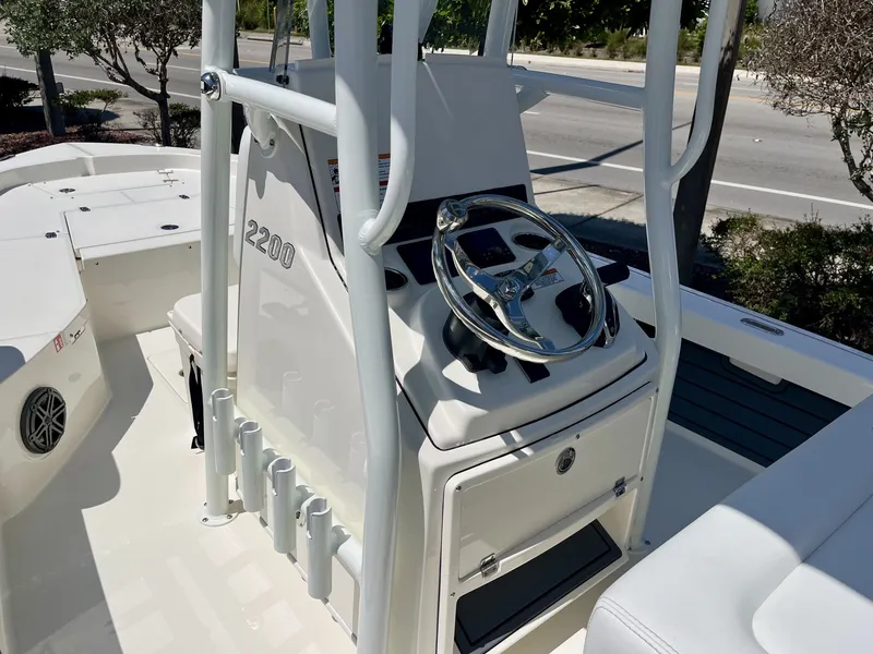 Slide: The Image of Interior view of 2026 Pathfinder 2200 TRS boat with steering console. - 12