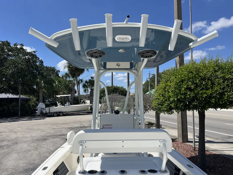 Slide: The Image of 2026 Pathfinder 2200 TRS boat with T-top and fishing rod holders. - 10