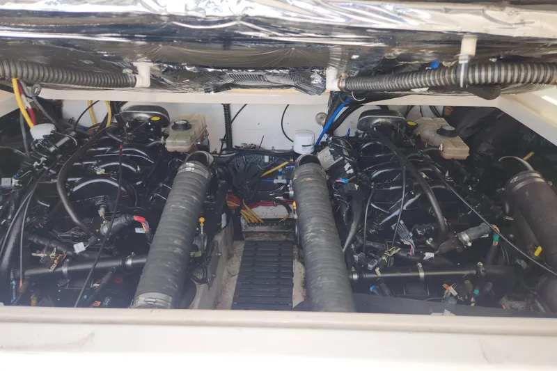 Slide: The Image of Engine compartment of a 2003 Tiara Yachts 3100 Open LE, showcasing dual engines and components. - 11